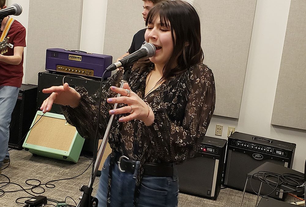 Uptown Music Collective Student, Cece Lutz performing in rehearsal for Tom Petty Show on April 12th & 13th at the Community Arts Center.